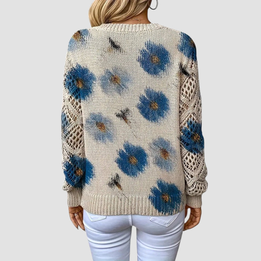 Pull fleuri col V — détail du motif floral et de la coupe ample