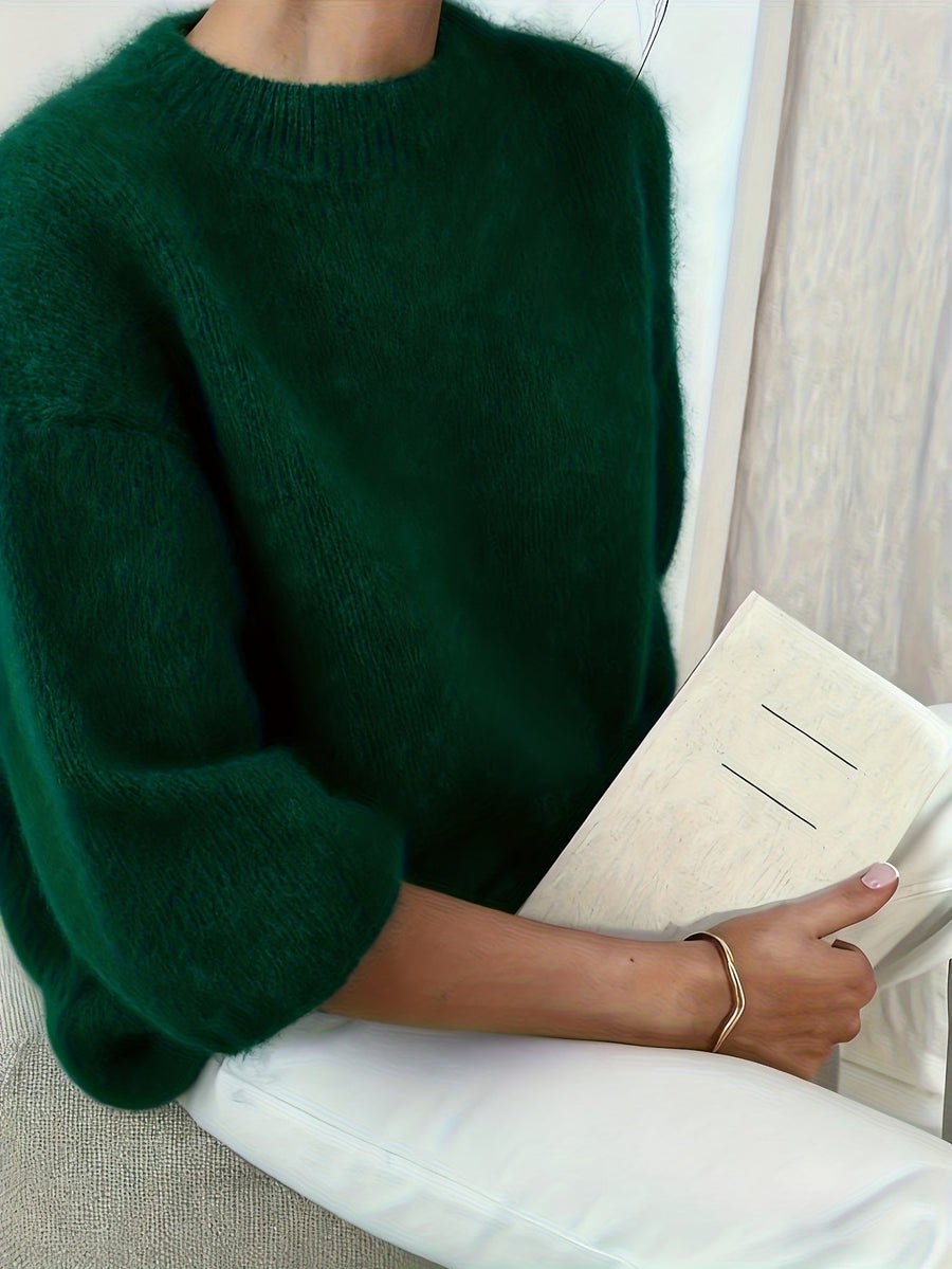 Pull oversize femme — détail des finitions et de la coupe aux hanches