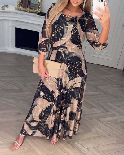 Élégante robe en mousseline imprimée à manches trois-quarts