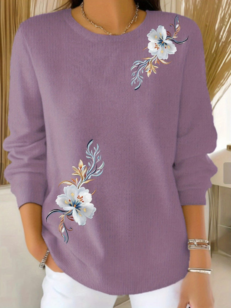 Pull col rond broderies florales — vue de profil avec coupe ample