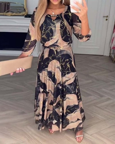 Élégante robe en mousseline imprimée à manches trois-quarts