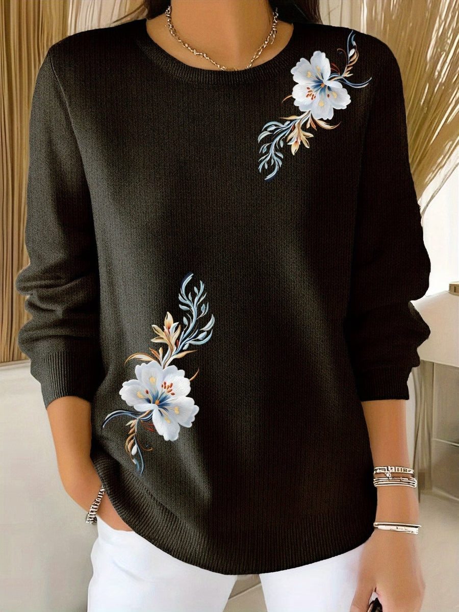 Pull col rond broderies florales — détail des broderies blanches délicates