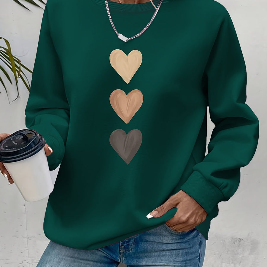 Pull col rond motif cœurs brodés — détail manche et bord côte