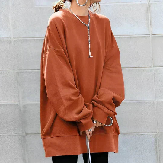 Sweat oversize col rond — détail des manches larges et poignets côtelés