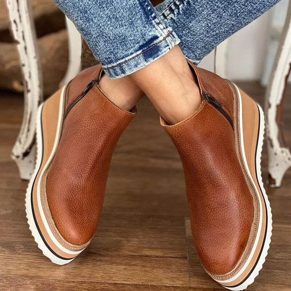 Bottines Clara — détail de la cremallère latérale et finitions