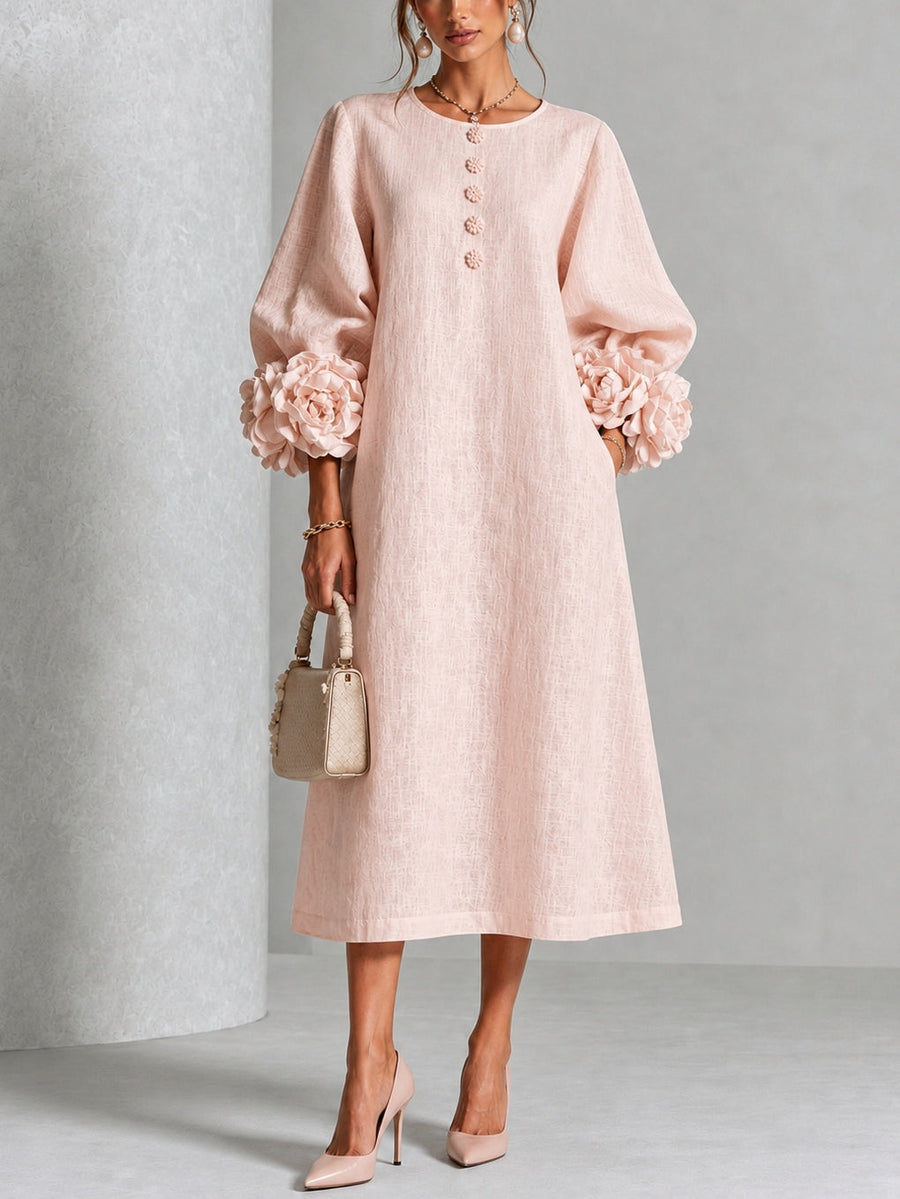 Robe Fleurine rose poudré — vue de face avec manches fleuries en relief