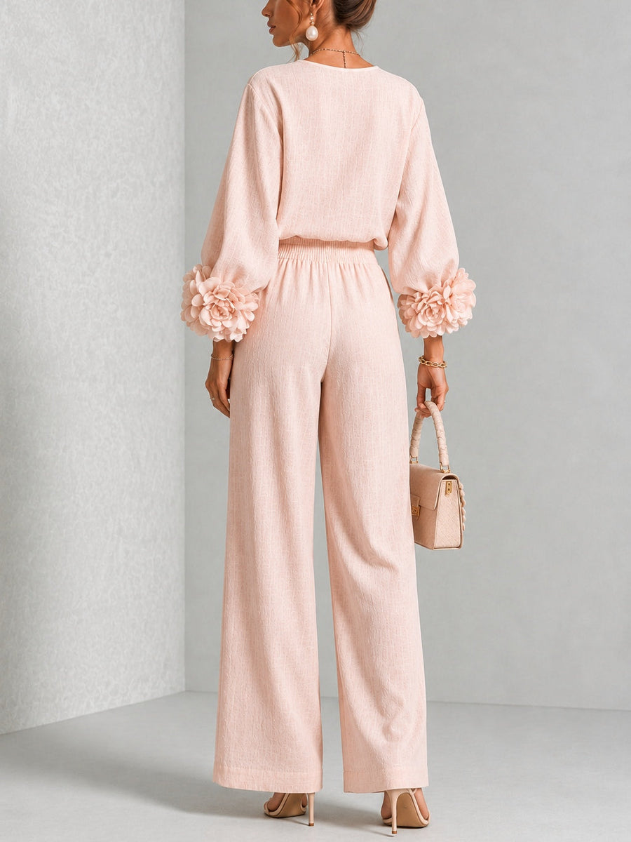 Ensemble Rosalie rose — détail des manches bouffantes avec fleur en relief