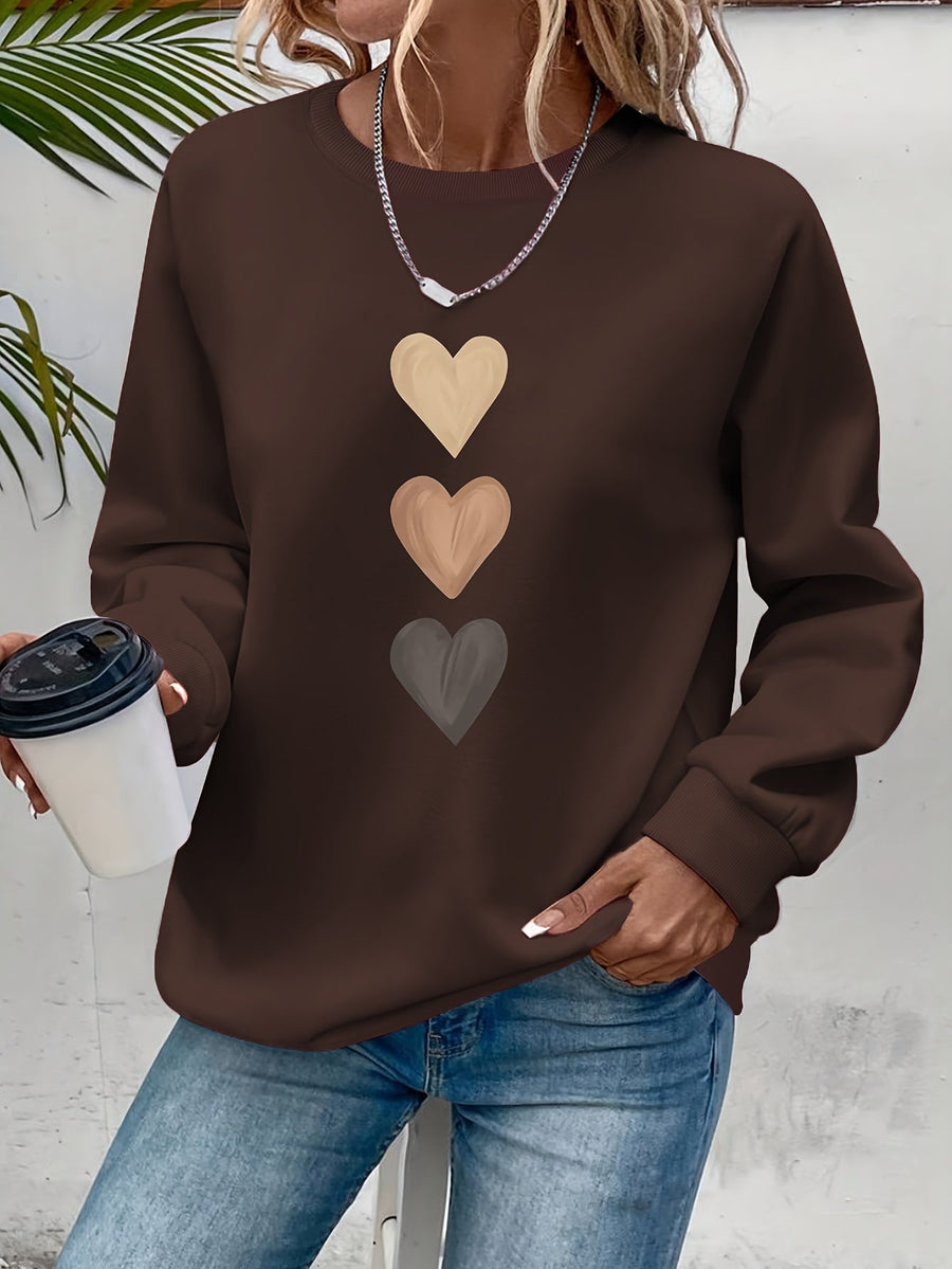 Pull col rond motif cœurs brodés — détail broderie cœurs