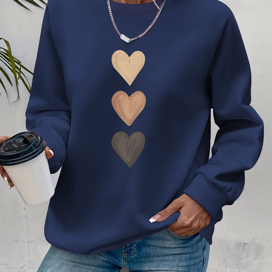 Pull col rond motif cœurs brodés — détail broderie rapprochée